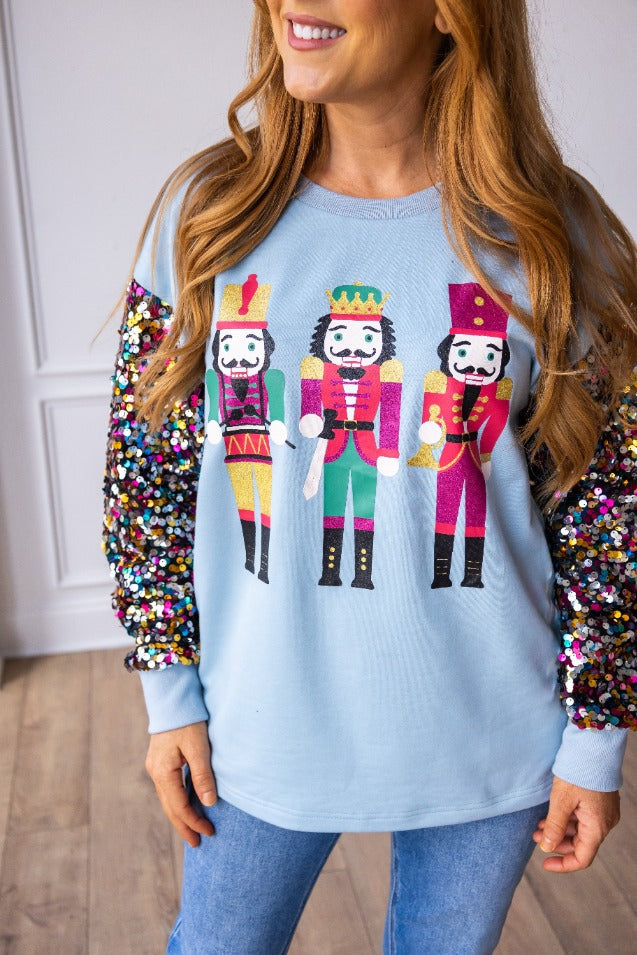 SG Array Live Nutcrackers on Blue Sweatshirt with Sequin Sleeves