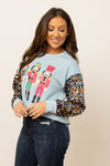 SG Array Live Nutcrackers on Blue Sweatshirt with Sequin Sleeves